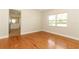 Bedroom featuring hardwood floors and a sunlit window at 656 Lake Charm Dr, Oviedo, FL 32765