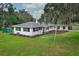Charming single story home featuring a well-maintained lawn and manicured landscaping at 656 Lake Charm Dr, Oviedo, FL 32765