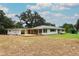 Sprawling ranch-style house with a long covered porch at 656 Lake Charm Dr, Oviedo, FL 32765