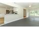 Open-concept kitchen with breakfast bar connecting to a large living space at 656 Lake Charm Dr, Oviedo, FL 32765