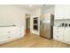 Bright kitchen featuring stainless steel appliances, sleek countertops, and wood-look flooring at 656 Lake Charm Dr, Oviedo, FL 32765