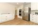 Kitchen featuring stainless steel refrigerator, built-in oven, and marble countertops at 656 Lake Charm Dr, Oviedo, FL 32765