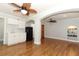 Living area featuring a kitchenette with white cabinetry, sink, and black refrigerator at 656 Lake Charm Dr, Oviedo, FL 32765