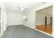 Open living area shows access to kitchen and adjacent hardwood floor room at 656 Lake Charm Dr, Oviedo, FL 32765