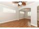 Open-concept living room boasting wood floors, shuttered windows and ample natural light at 656 Lake Charm Dr, Oviedo, FL 32765