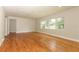 Bright living room featuring hardwood floors and large windows offering natural light at 656 Lake Charm Dr, Oviedo, FL 32765