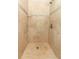 Tiled walk-in shower with neutral tones, decorative trim, and a modern shower head and fixtures at 656 Lake Charm Dr, Oviedo, FL 32765
