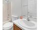 Bathroom featuring a single sink vanity and a shower-tub combo at 672 Reindeer Dr, Kissimmee, FL 34759