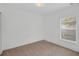 Bright bedroom with plush carpeting and a window for natural light at 672 Reindeer Dr, Kissimmee, FL 34759