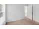 Bedroom with white walls featuring a window and a door frame at 672 Reindeer Dr, Kissimmee, FL 34759