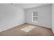 Neutral carpeted bedroom with plenty of natural light, providing a blank canvas for personal touches at 672 Reindeer Dr, Kissimmee, FL 34759