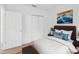 Bedroom with white trim, carpeted flooring, and a neatly made bed at 672 Reindeer Dr, Kissimmee, FL 34759