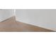 This carpeted bedroom with white trim features a door on the left at 672 Reindeer Dr, Kissimmee, FL 34759