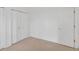 Bedroom featuring a double door closet and traditional door at 672 Reindeer Dr, Kissimmee, FL 34759