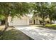 Charming single-Gathering home with a two-car garage and a well-maintained front yard at 672 Reindeer Dr, Kissimmee, FL 34759