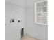 Clean laundry area equipped with hookups and a window for natural light at 672 Reindeer Dr, Kissimmee, FL 34759