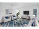 Stylishly furnished living room featuring a cozy seating area and modern decor at 672 Reindeer Dr, Kissimmee, FL 34759