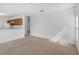 Spacious living area with neutral carpet, natural light and open layout, perfect for relaxing or entertaining at 672 Reindeer Dr, Kissimmee, FL 34759