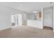Bright living area with a sliding door to the outside, adjacent to an open kitchen at 672 Reindeer Dr, Kissimmee, FL 34759