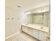 Bathroom featuring double sinks, white cabinetry, and a shower-tub combo at 7054 Cadiz Blvd, Orlando, FL 32819