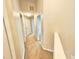 Upstairs hallway featuring neutral walls, carpet, and access to multiple rooms at 7054 Cadiz Blvd, Orlando, FL 32819