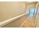 Hallway with neutral walls and plush carpeting at 7054 Cadiz Blvd, Orlando, FL 32819