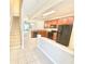 Eat-in kitchen featuring wooden cabinetry, granite counters, and black appliances at 7054 Cadiz Blvd, Orlando, FL 32819
