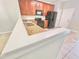 Eat-in kitchen featuring wooden cabinetry, granite counters, and black appliances at 7054 Cadiz Blvd, Orlando, FL 32819
