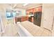 Eat-in kitchen featuring wooden cabinetry, granite counters, and black appliances at 7054 Cadiz Blvd, Orlando, FL 32819