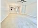 Open concept living room featuring neutral walls and plush carpeting at 7054 Cadiz Blvd, Orlando, FL 32819