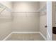 Walk-in closet with ample storage space, wire shelving and neutral carpet at 7201 Halton Ct, Windermere, FL 34786