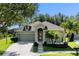 Charming one-story home with a two-car garage, beautiful landscaping, and a well-maintained lawn at 7201 Halton Ct, Windermere, FL 34786