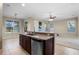 Open kitchen featuring granite countertops, stainless steel dishwasher, and views to the living room at 7201 Halton Ct, Windermere, FL 34786