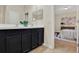 Elegant bathroom featuring a double vanity, a clean aesthetic, and access to the main bedroom at 8245 Laureate Blvd, Orlando, FL 32827