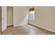 An empty bedroom with tiled floors, natural light, and a closet at 8245 Laureate Blvd, Orlando, FL 32827