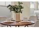 Close-up of an elegant dining table with seating for four, and beautifully set plates at 8245 Laureate Blvd, Orlando, FL 32827