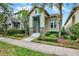 Charming exterior view with nicely landscaped front yard and appealing architectural details at 8245 Laureate Blvd, Orlando, FL 32827