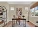 Bright home office space featuring neutral paint, natural light, and a minimalist aesthetic at 8245 Laureate Blvd, Orlando, FL 32827