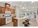 Well-appointed kitchen offering an island with bar seating and stainless steel appliances at 8245 Laureate Blvd, Orlando, FL 32827