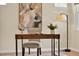 Cozy home office with a wooden desk, gray chair, modern lamp, and abstract art at 8245 Laureate Blvd, Orlando, FL 32827