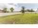 Backyard with a green lawn and long white fence at 856 Teton St, Haines City, FL 33844