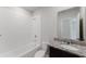 Bathroom featuring a shower/tub combo with tile surround, vanity, and granite countertop at 856 Teton St, Haines City, FL 33844