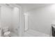 Bright bathroom featuring a walk-in shower and toilet at 856 Teton St, Haines City, FL 33844