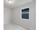 Bright, carpeted bedroom with a window providing natural light at 856 Teton St, Haines City, FL 33844