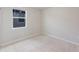 Bedroom with neutral carpet and large window at 856 Teton St, Haines City, FL 33844