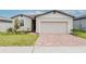 Charming single-Gathering home featuring a brick driveway and well-maintained front yard at 856 Teton St, Haines City, FL 33844