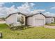 Charming one-story home with a brick driveway and well-manicured lawn at 856 Teton St, Haines City, FL 33844