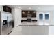 Updated kitchen featuring an island, stainless steel appliances, granite countertops, and ample cabinet space at 856 Teton St, Haines City, FL 33844