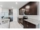Open kitchen featuring stainless steel appliances, granite countertops and island at 856 Teton St, Haines City, FL 33844