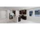 Modern kitchen featuring granite countertops, stainless steel appliances and an island at 856 Teton St, Haines City, FL 33844